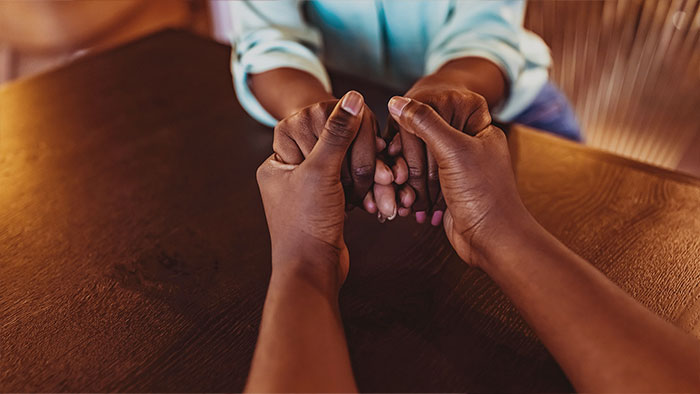 Hands held in prayer